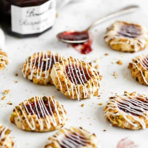 pistachio thumbprint cookies filled with raspberry jam
