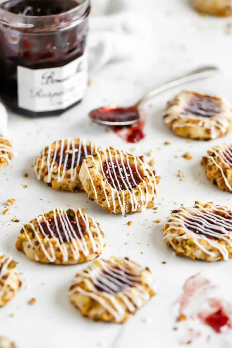 pistachio thumbprint cookies filled with raspberry jam