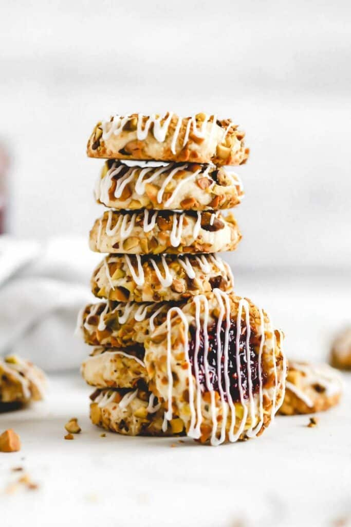 a stack of raspberry pistachio cookies