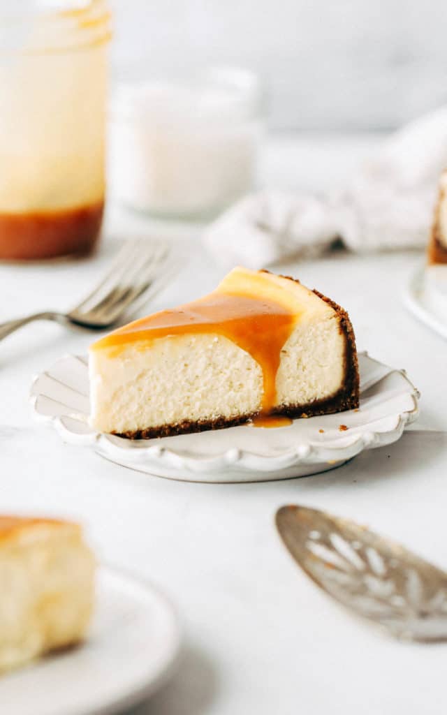 a slice of caramel cheesecake on a dessert plate