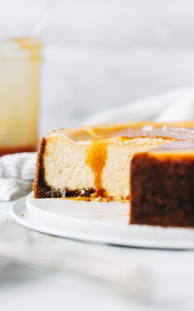 side shot of the inside of a sliced caramel cheesecake