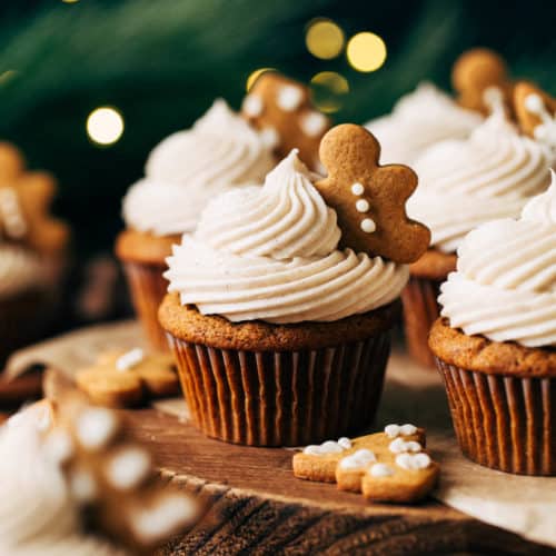 gingerbread cupcakes arranged on a rustic wood board