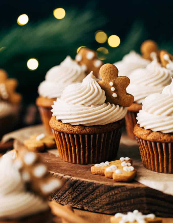 gingerbread cupcakes arranged on a rustic wood board