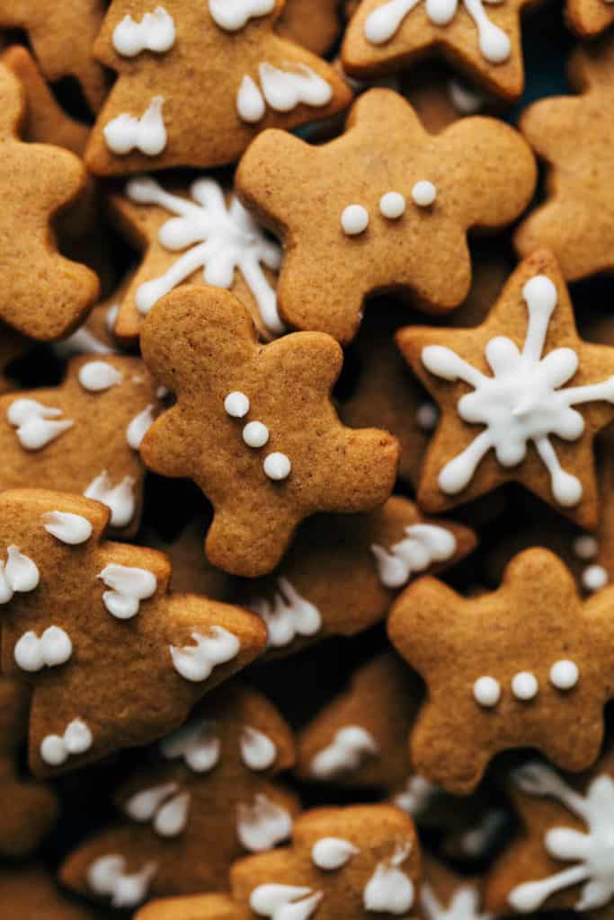 a close up of mini gingerbread cookies gathered together in a pile