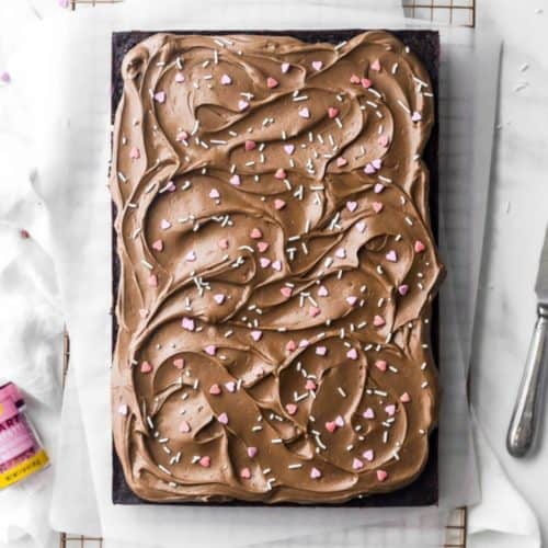 chocolate sheet cake with heart sprinkles and chocolate frosting