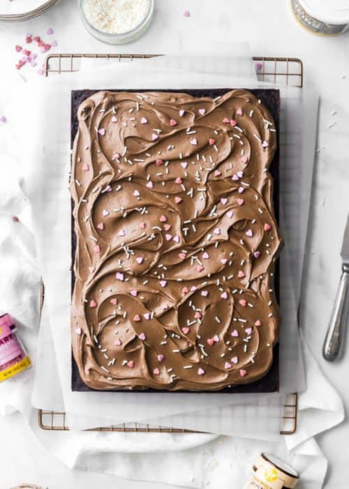 chocolate sheet cake with heart sprinkles and chocolate frosting