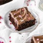 a slice of chocolate sheet cake on a plate