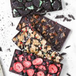 four difference homemade chocolate bars with tons of toppings