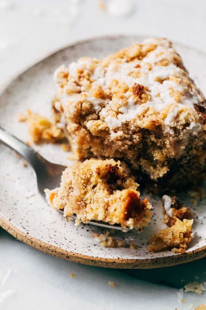 a bite taken from a slice of banana coffee cake