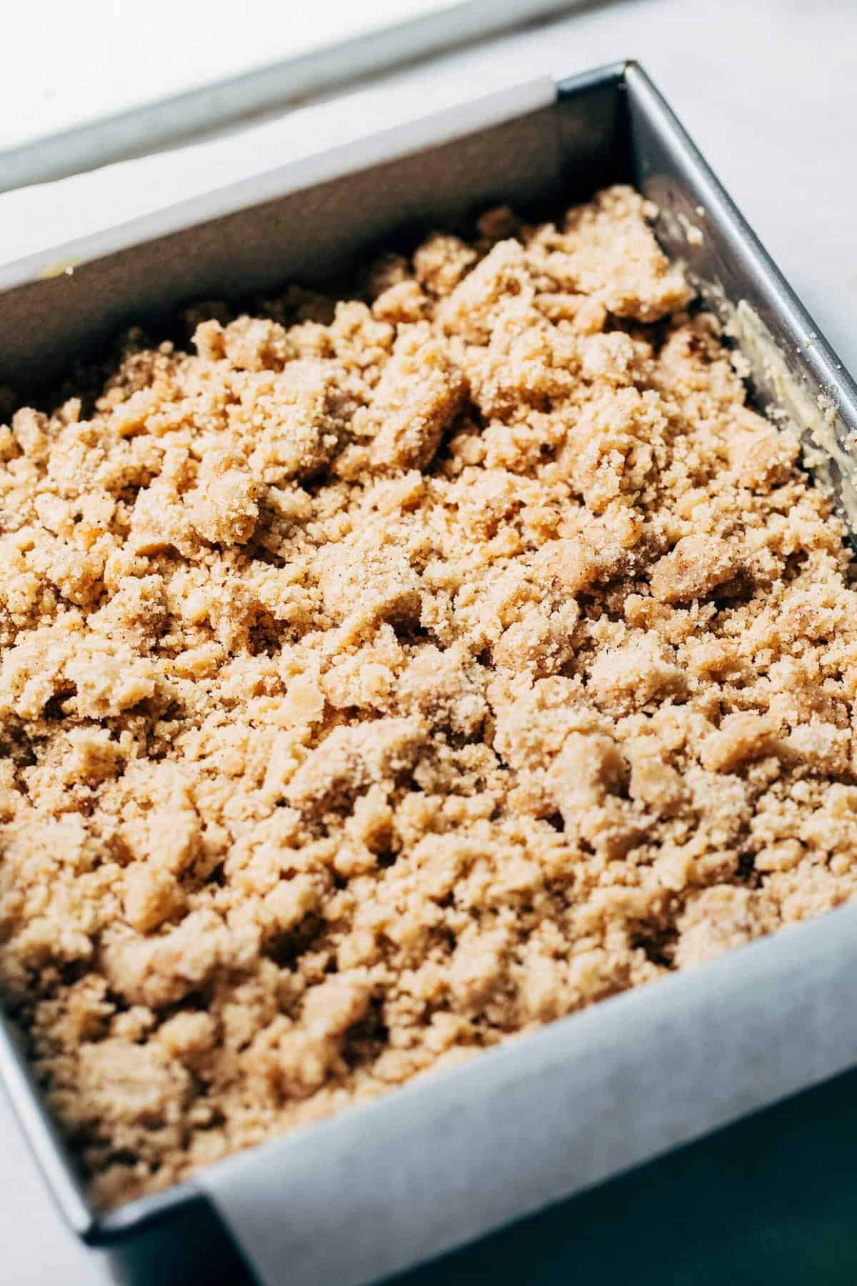 banana cake covered in a crumble topping before baking