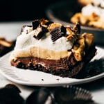 a slice of layered chocolate peanut butter pie