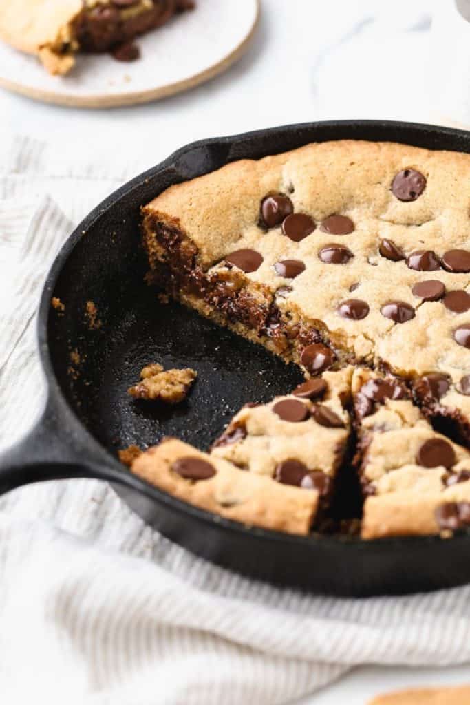the inside of a sliced skillet cookie pie