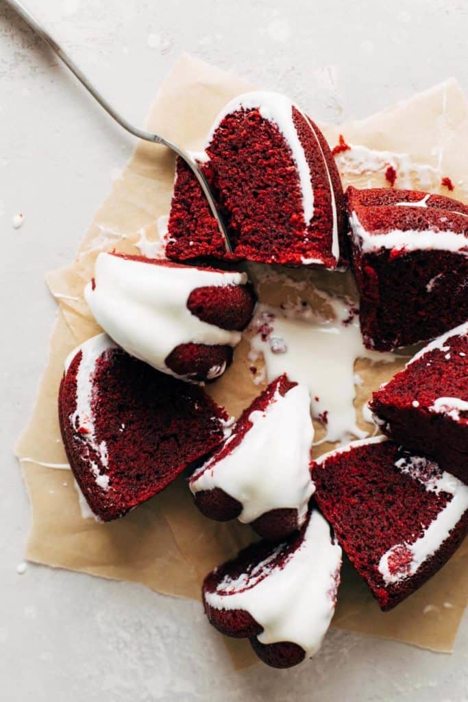 an overhead shot of scattered slices of red velvet bundt cake