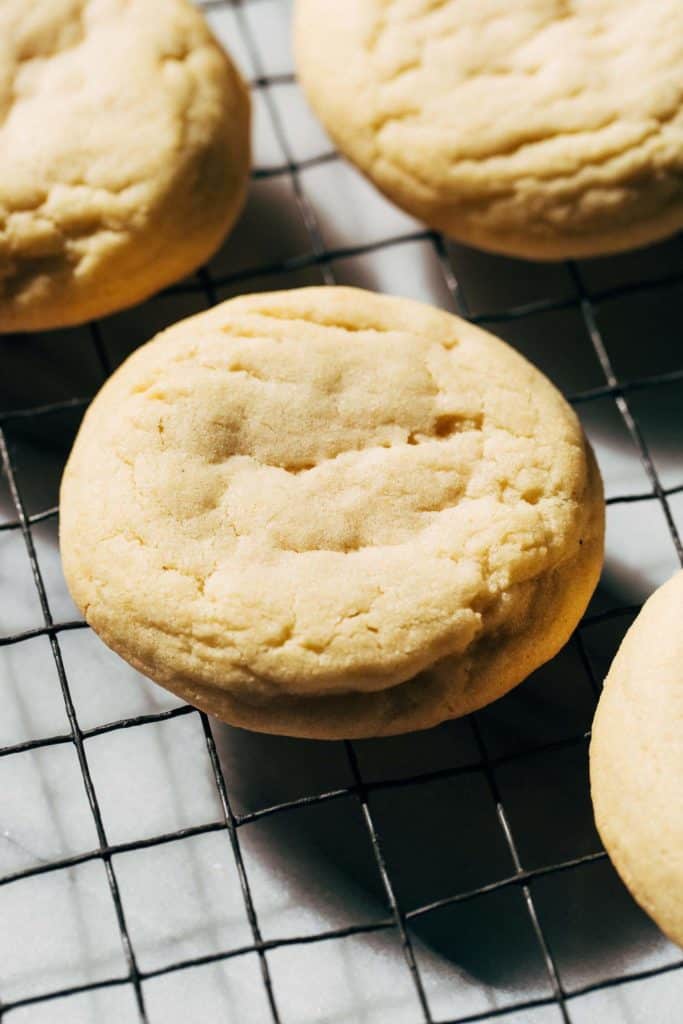 a freshly baked sugar cookie on a cooling rack