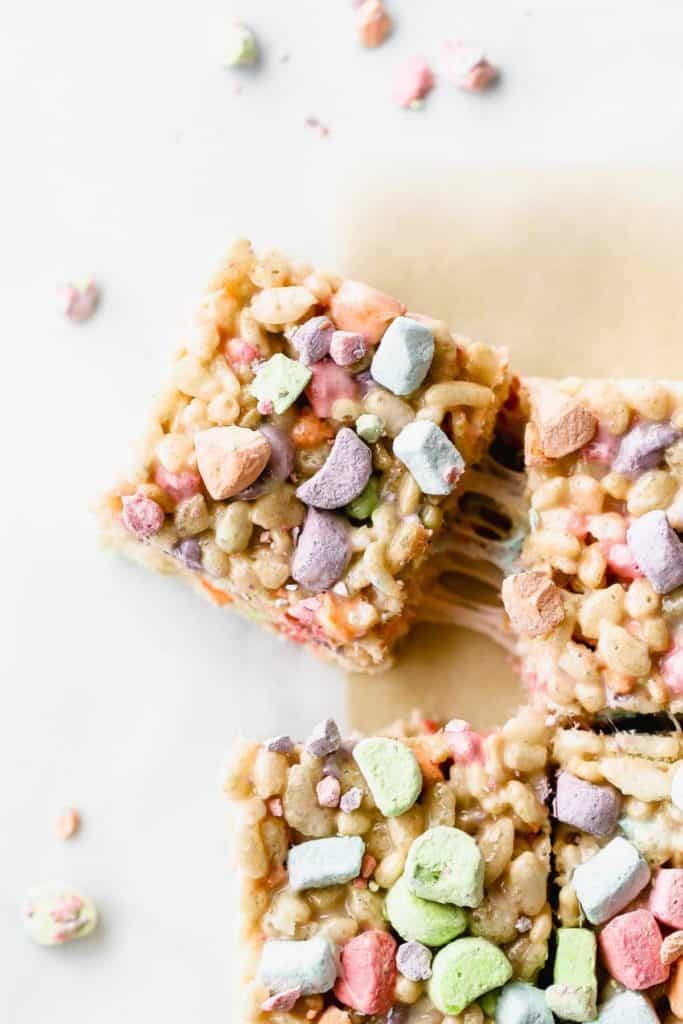 a lucky charms marshmallow treat being pulled from the rest