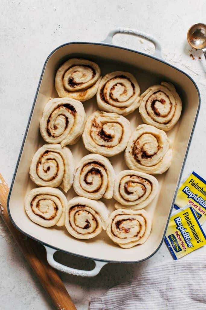 a pan of raw cinnamon rolls