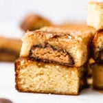 a stack of reese's stuffed white chocolate brownies