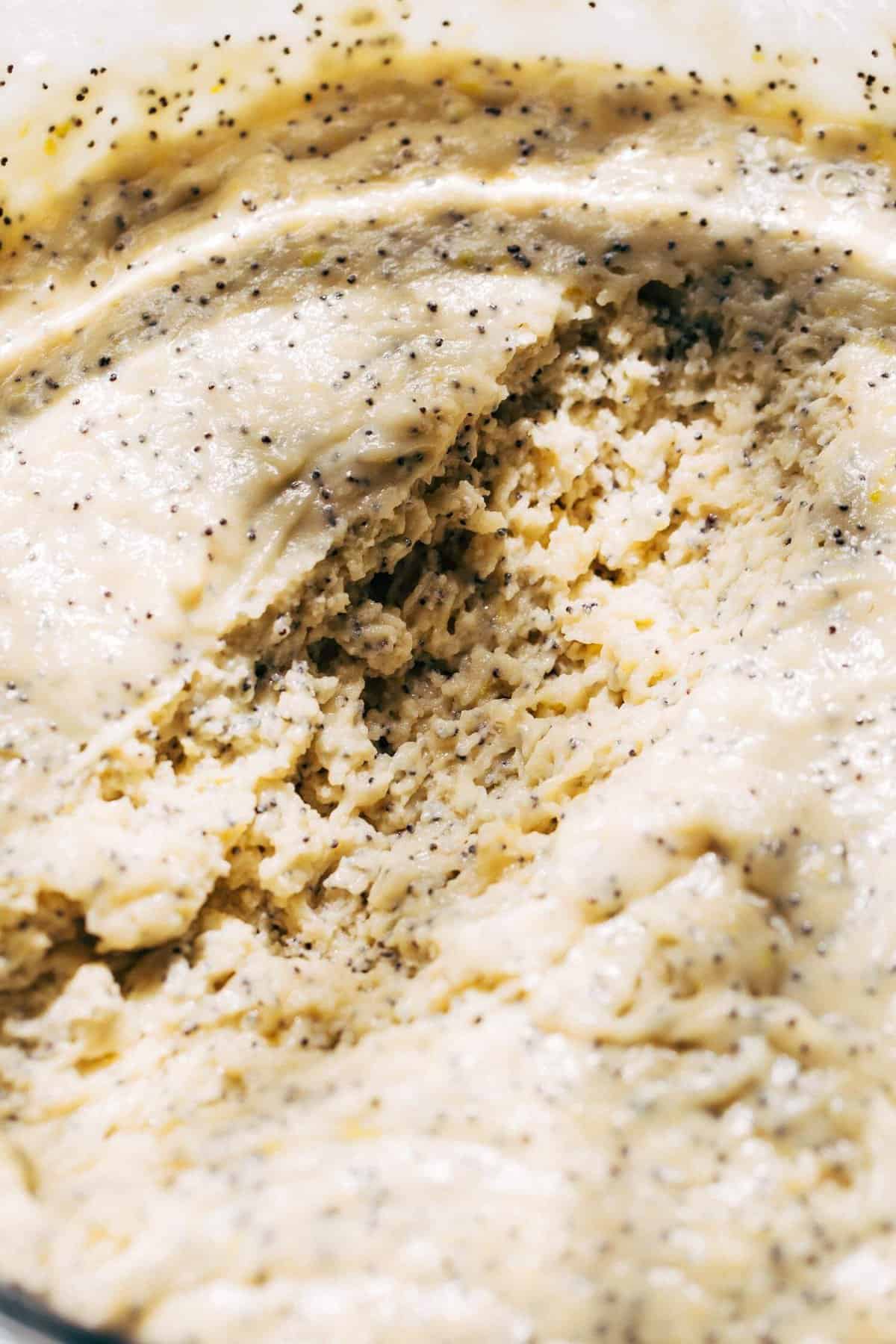 a bowl of lemon poppy seed muffin batter