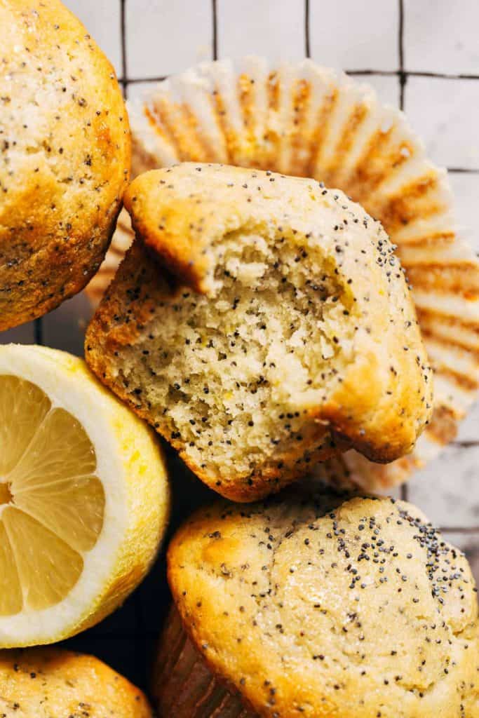 close up on a bite taken from a lemon poppy seed muffin