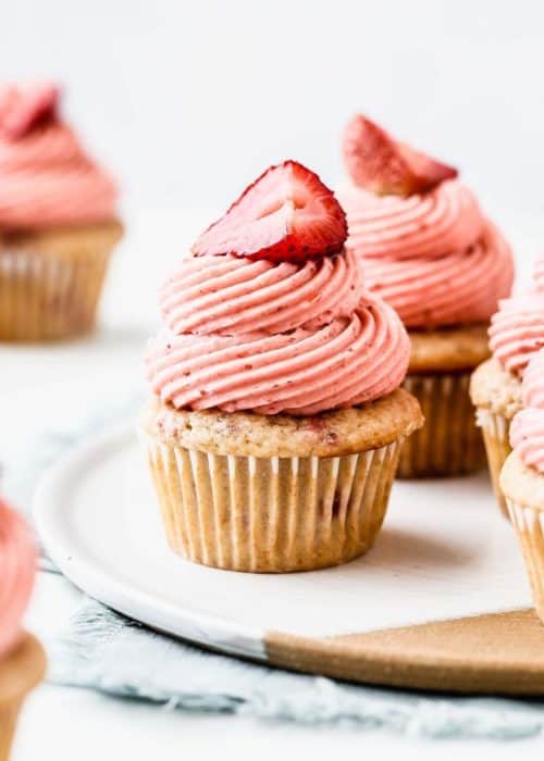 a strawberry cupcake on a tray