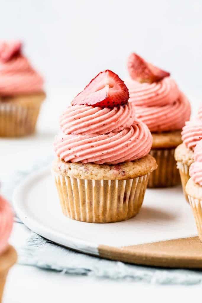 a strawberry cupcake on a tray