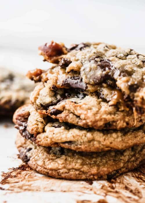 a stack of melty salted caramel chocolate chip cookies