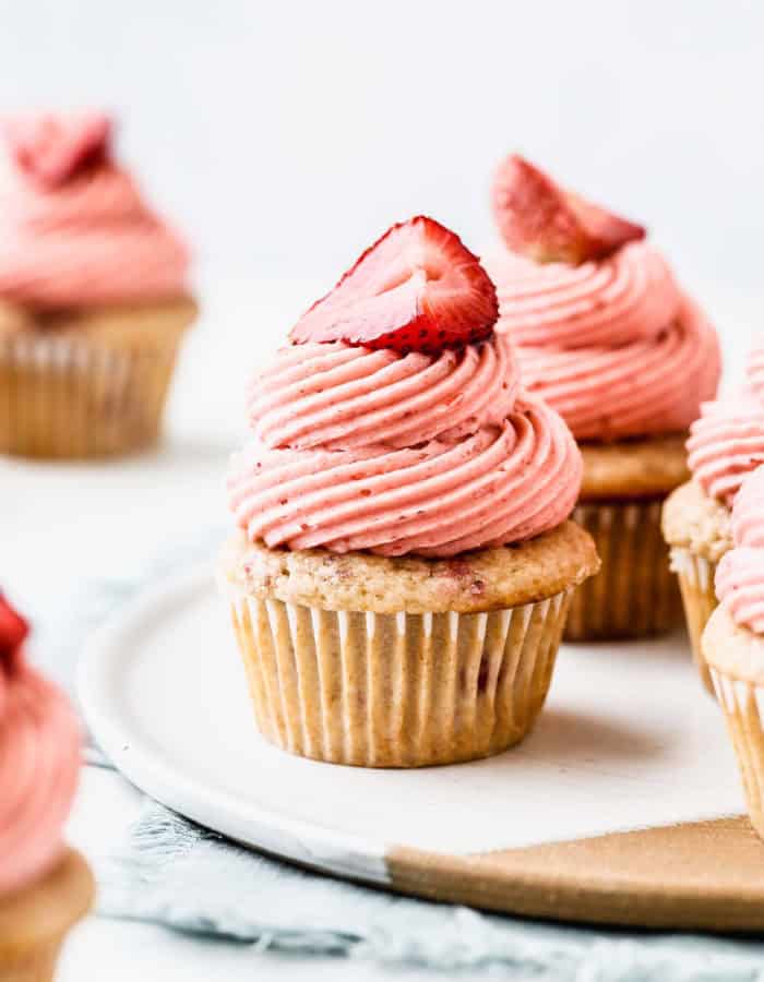 strawberry cupcakes on a ceramic plate