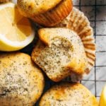 lemon poppy seed muffins scattered on a cooling rack