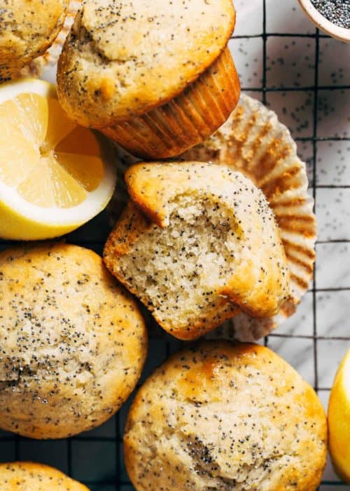 lemon poppy seed muffins scattered on a cooling rack