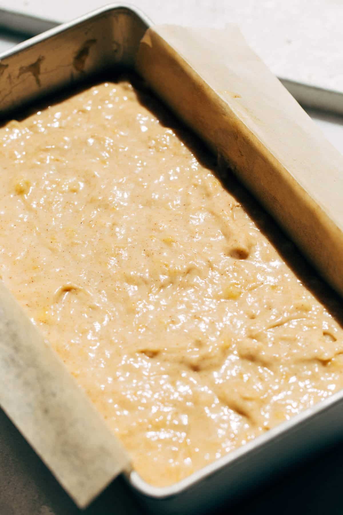 banana bread batter in a loaf pan