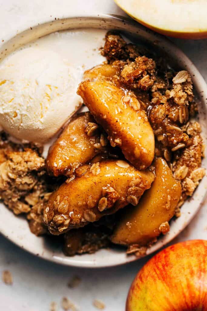 apple crisp in a bowl with ice cream