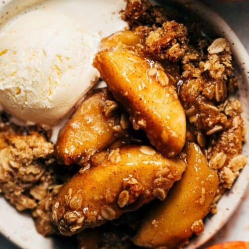 apple crisp in a bowl with ice cream