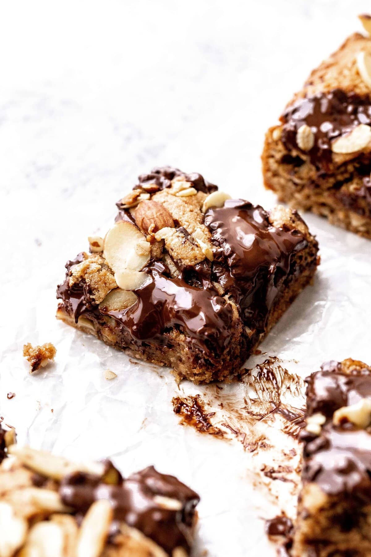 a single slice of an almond chocolate chip cookie bar