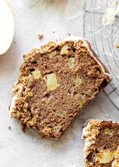 This apple cinnamon bread is loaded with fresh apples and topped with a crunchy oat streusel topping. It's perfectly spiced and makes for a delicious and simple apple dessert! #applebread #apples #appledessert #cinnamon #butternutbakery