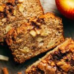 a slice of apple cinnamon bread with chunks of apples