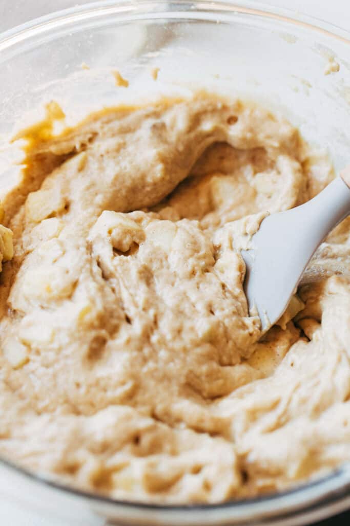 a bowl of apple cinnamon bread batter