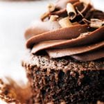 close up on a chocolate cupcake with chocolate curls on top