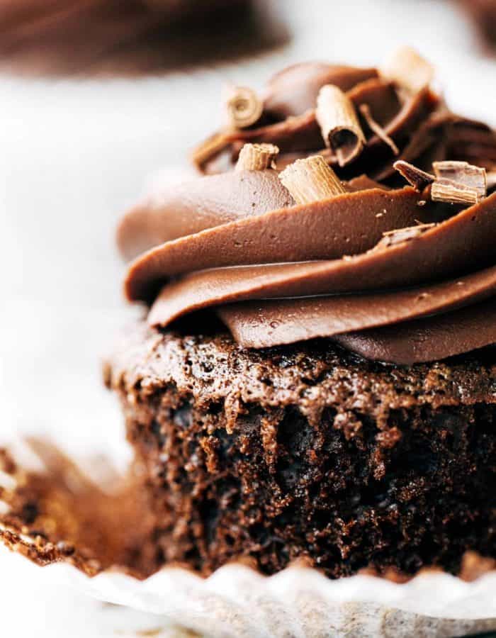 close up on a chocolate cupcake with chocolate curls on top