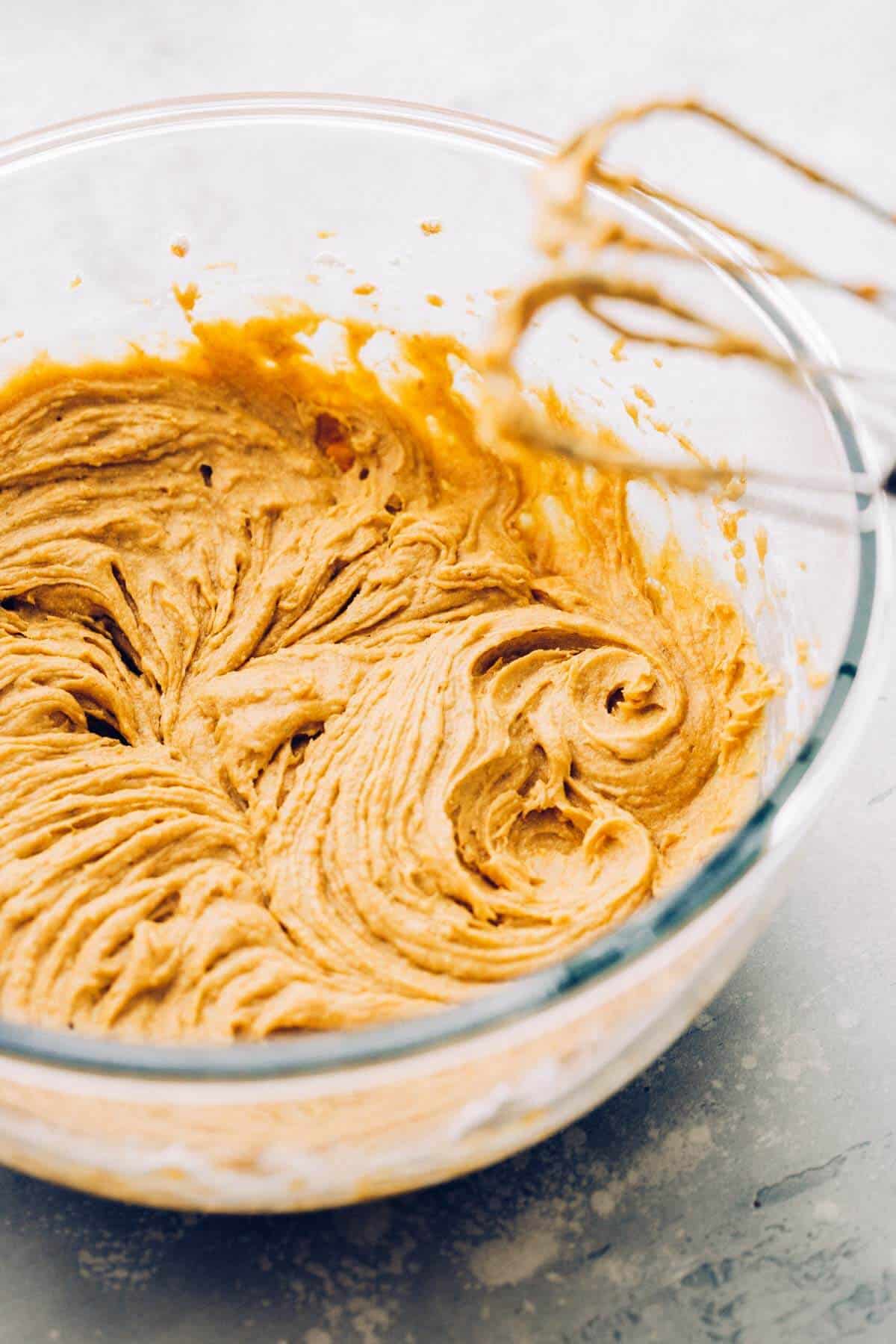 a bowl of gluten free pumpkin muffin batter