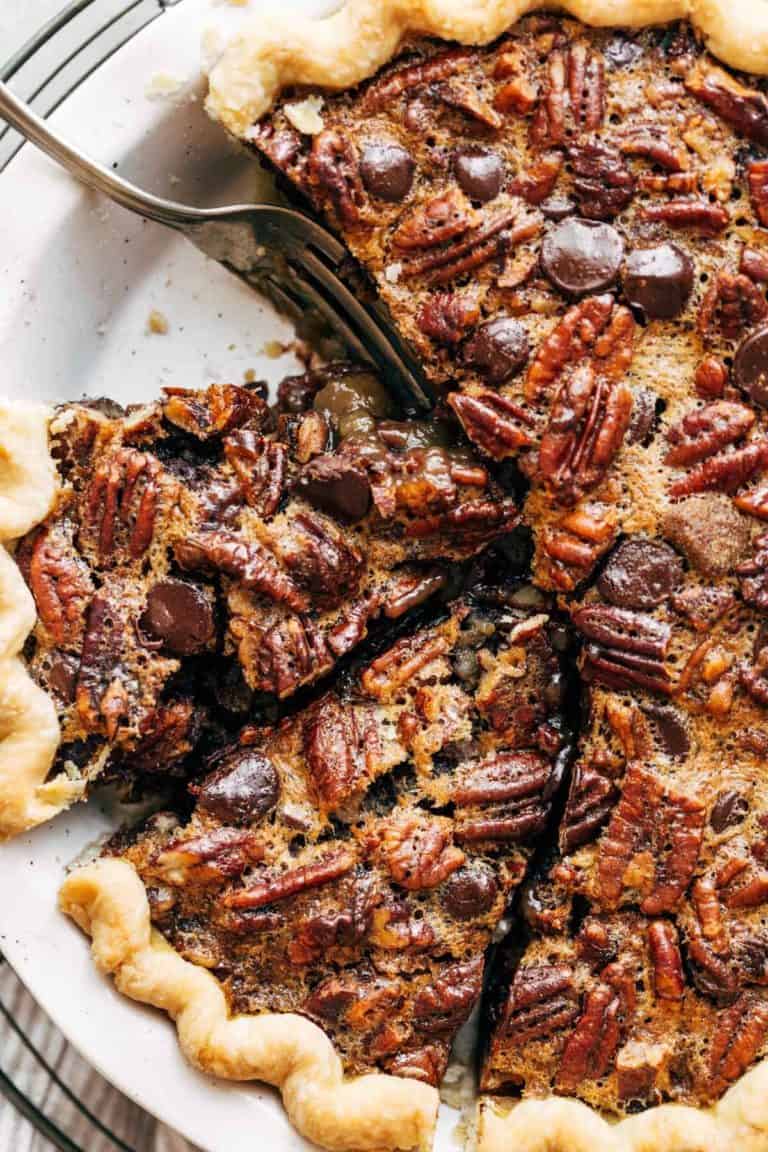 Close up of a sliced pecan pie.