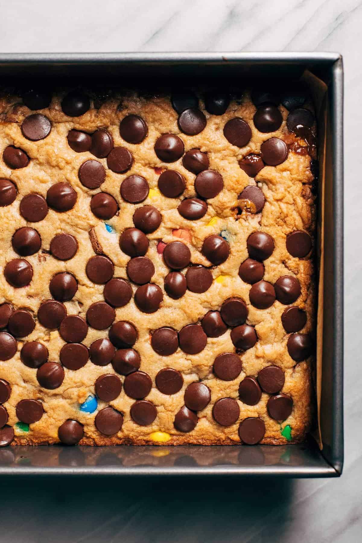 the top of halloween candy cookie bars sprinkled with chocolate chips