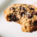 close up on a bite taken from a gluten free oatmeal chocolate chip cookie