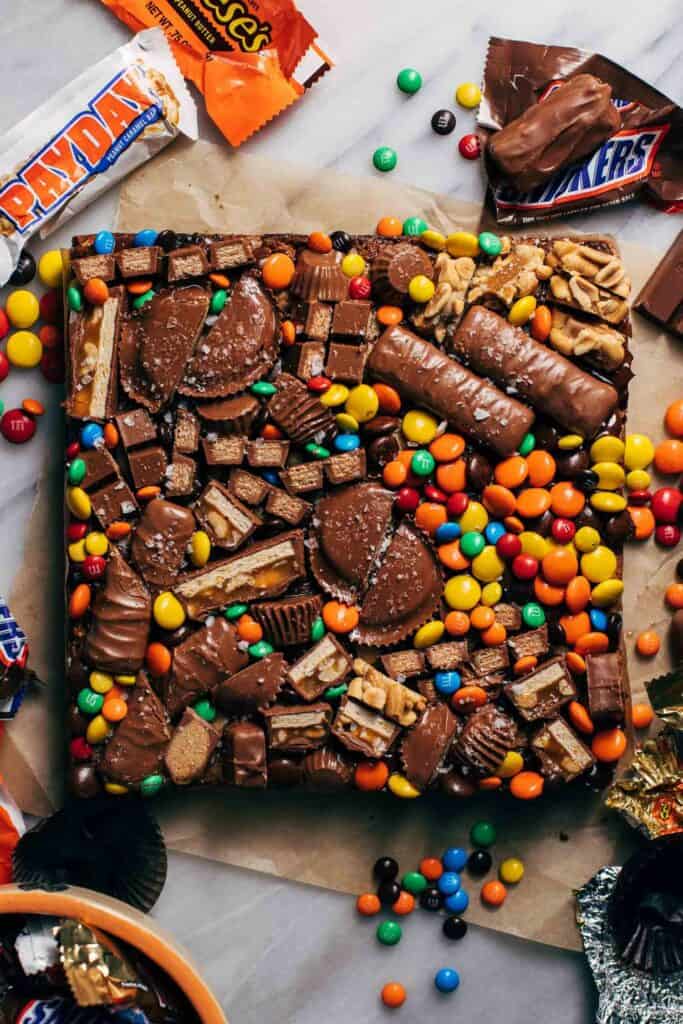 halloween candy loaded on top of cookie bars