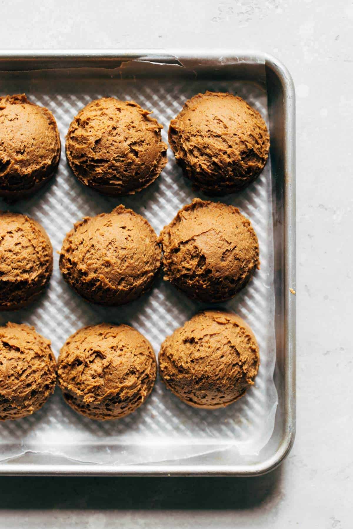 a tray of scooped molasses cookie dough