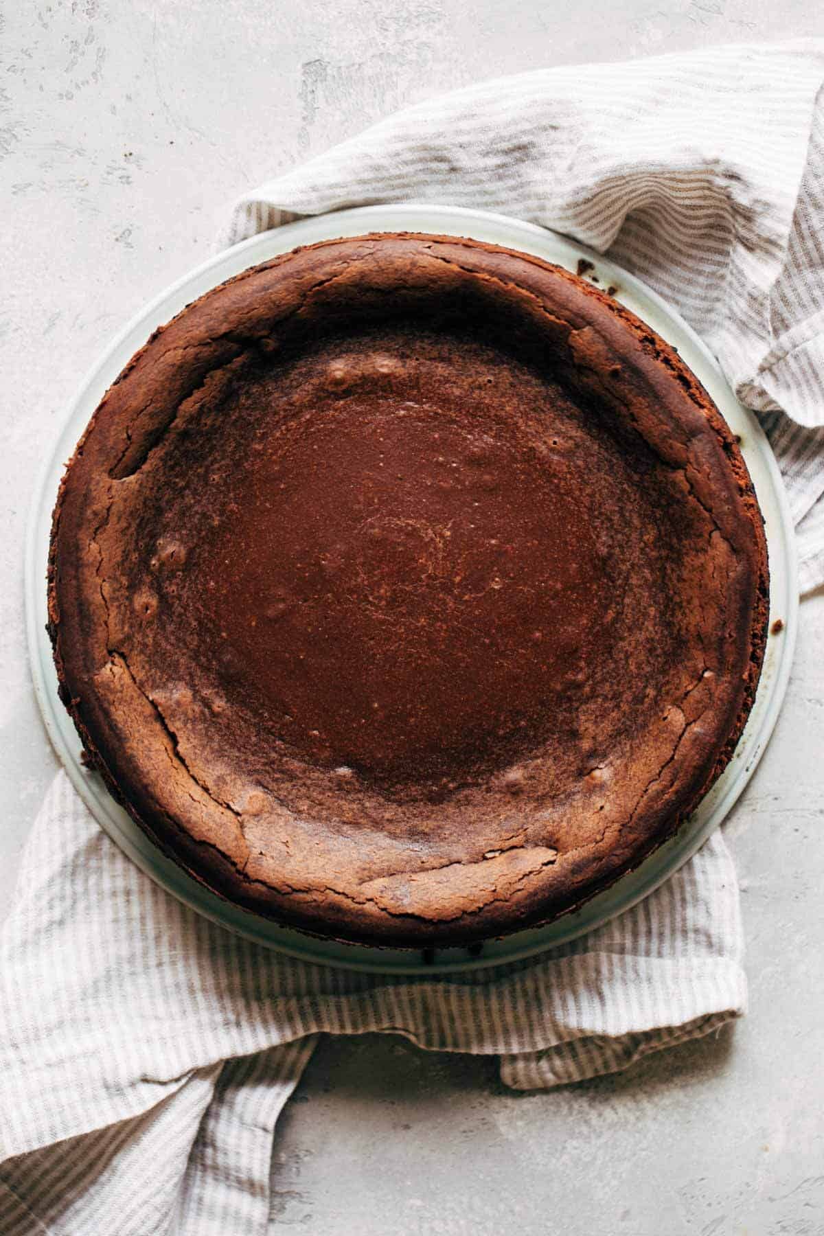 baked chocolate cheesecake removed from the tin