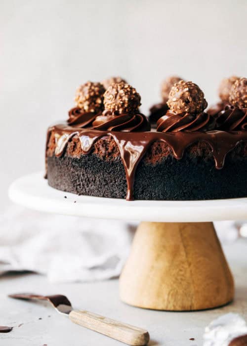 chocolate cheesecake with chocolate ganache dripping off the side