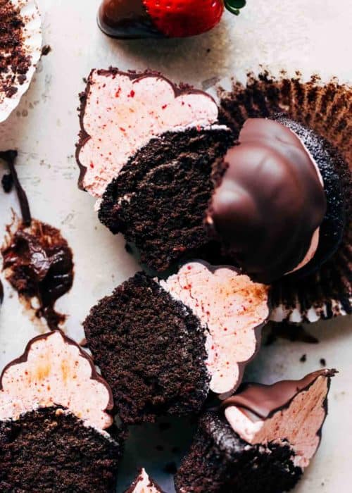 sliced chocolate strawberry hi hat cupcakes laying in their sides