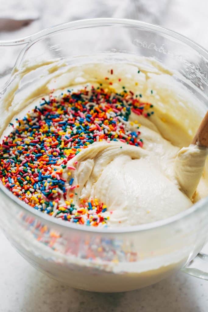 a bowl of cake batter with sprinkles
