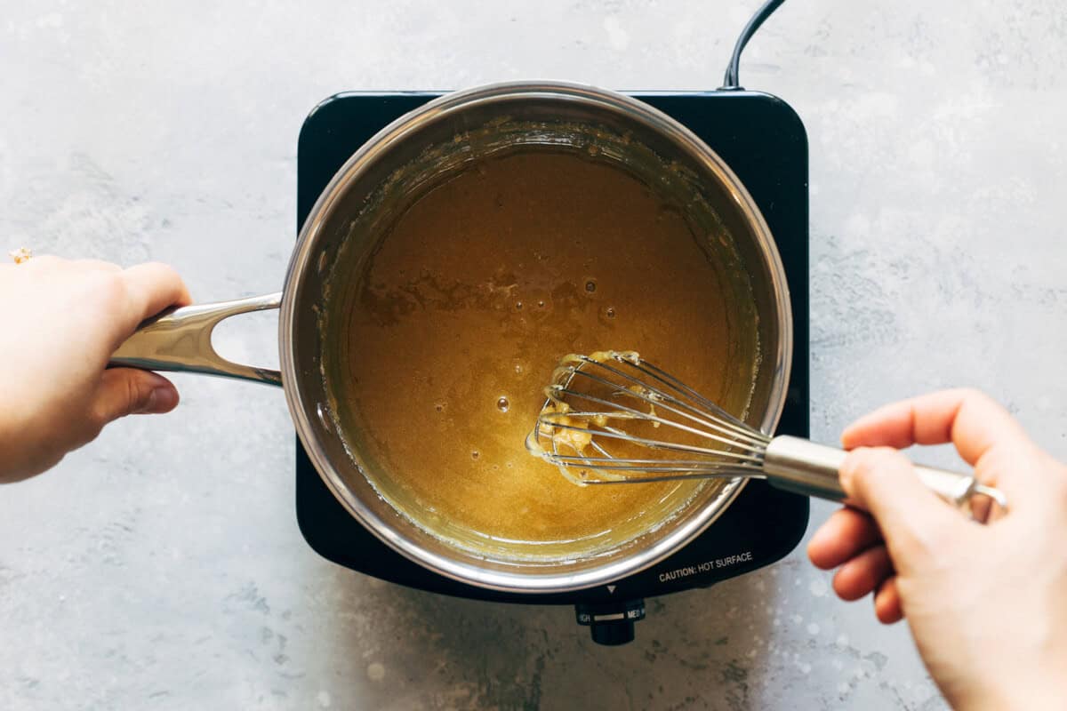 Whisking homemade salted caramel.