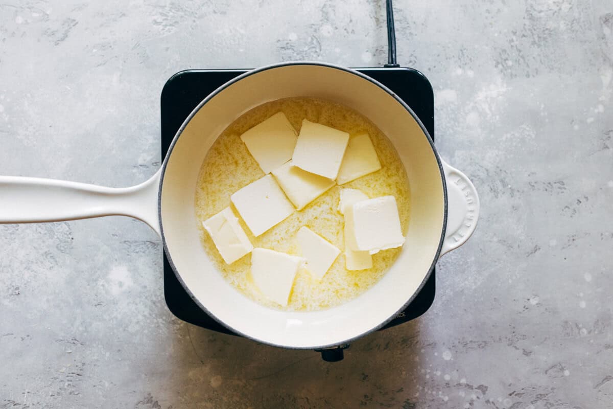 pats of butter melting in a saucepan